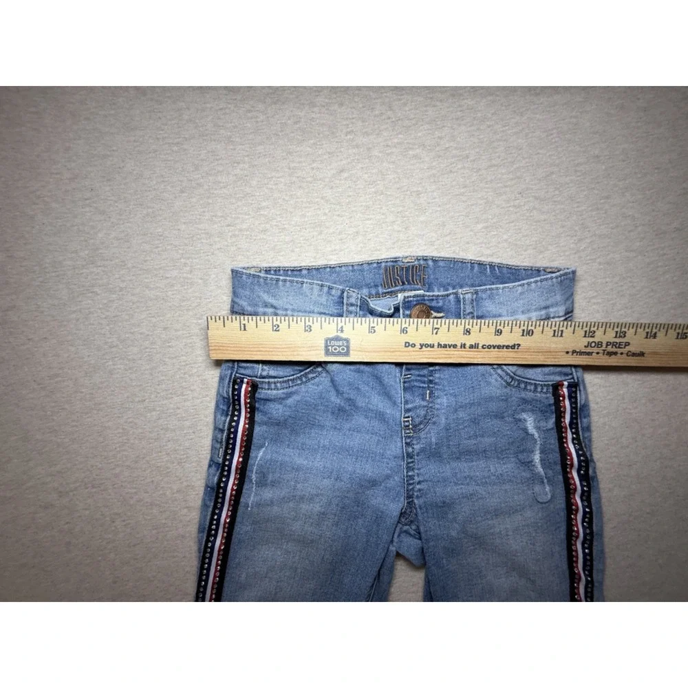 Justice. girl size 10. blue jean with red white and blue side. 4th of july.